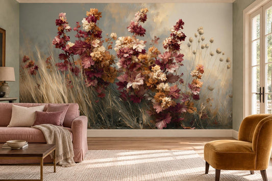 Autumn wildflower and golden grass wall mural in a living room with a dusty-pink sofa and a mustard velvet armchair