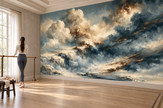 Blue and ivory cloudscape mural in a dance studio where a woman stretches at a brass barre on a wood floor with a bench nearby